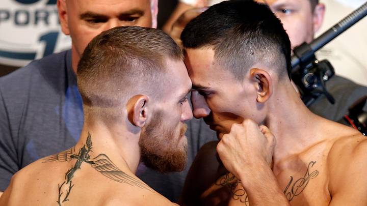 Aug 16, 2013; Boston, MA, USA; Conor McGregor (left) poses with Max Holloway during the weigh-in for their UFC fight at TD Garden tomorrow night. Mandatory Credit: Winslow Townson-USA TODAY Sports